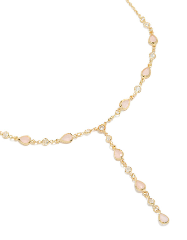 Showcasing a gold plated pink oval cubic zirconia Y-necklace close up view
