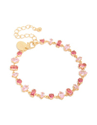 Showcasing a gold large pink multi-cut cubic zirconia tennis bracelet front view - link has visual effect only