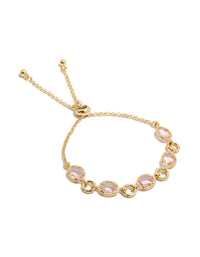 Showcasing a gold plated bracelet featuring large pink cubic zirconia stones front view - link has visual effect only