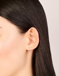 These gold plated surgical steel stud earrings with marquise cut cubic zirconia and flat back closure on ear view - link has visual effect only