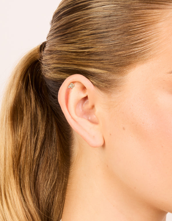 Featuring a gold plated titanium cubic zirconia rectangle cluster single flat back stud on ear view