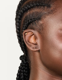 Featuring a gold plated titanium cubic zirconia pear cluster single flat back stud on ear view - link has visual effect only