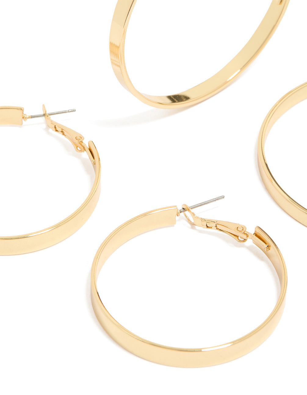 Showcasing statement wide flat hoop earrings in a 2-pack with gold plated material and closure detail close up view