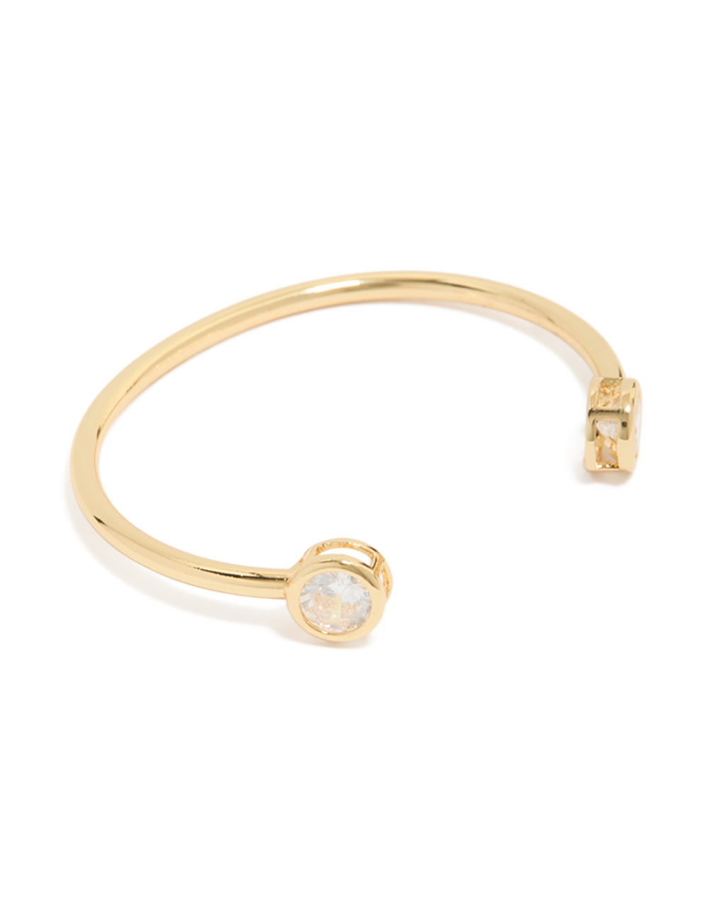 Crafted from gold plated material, this open wrist cuff bracelet features cubic zirconia in clear front view