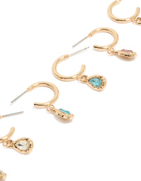 Featuring gold blue and pink diamante huggie earrings in a 3-pack with hoop closure close up view - link has visual effect only