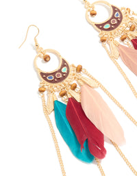 Elegant statement drop earrings featuring beads, charm, and feathers in gold close up view - link has visual effect only