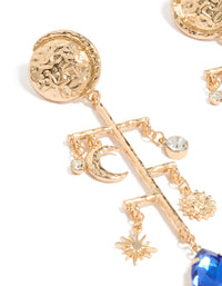 Showcasing worn gold sun and moon marble drop earrings with celestial charm details in statement style close up view - link has visual effect only