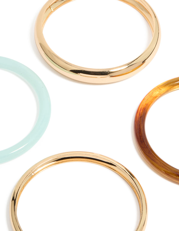 Showcasing gold and multicoloured acrylic bangles in a 4-pack with paleturquoise and brown accents close up view