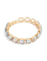 Showcasing a gold large light blue diamantes bracelet in front view - link has visual effect only