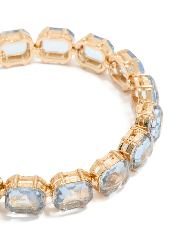 Elegant gold large light blue diamantes bracelet featuring close up view