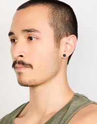Featuring waterproof stainless steel mens black cubic zirconia flat back stud earrings on model view - link has visual effect only