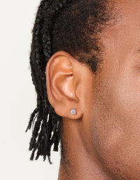 Featuring mens waterproof stainless steel mini round clear cubic zirconia stud earrings in silver on ear view - link has visual effect only