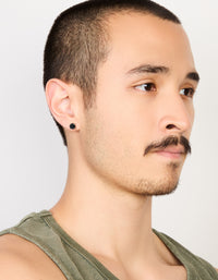 Featuring mens round cut stud earrings with black cubic zirconia in waterproof stainless steel and silver on model view - link has visual effect only