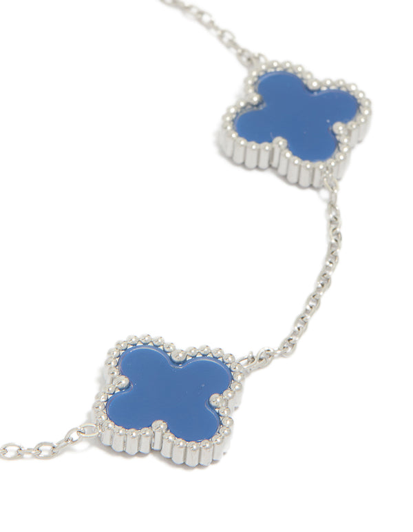Featuring a mens waterproof stainless steel navy clover chain bracelet with charm accents in cornflowerblue and silver, statement design close up view