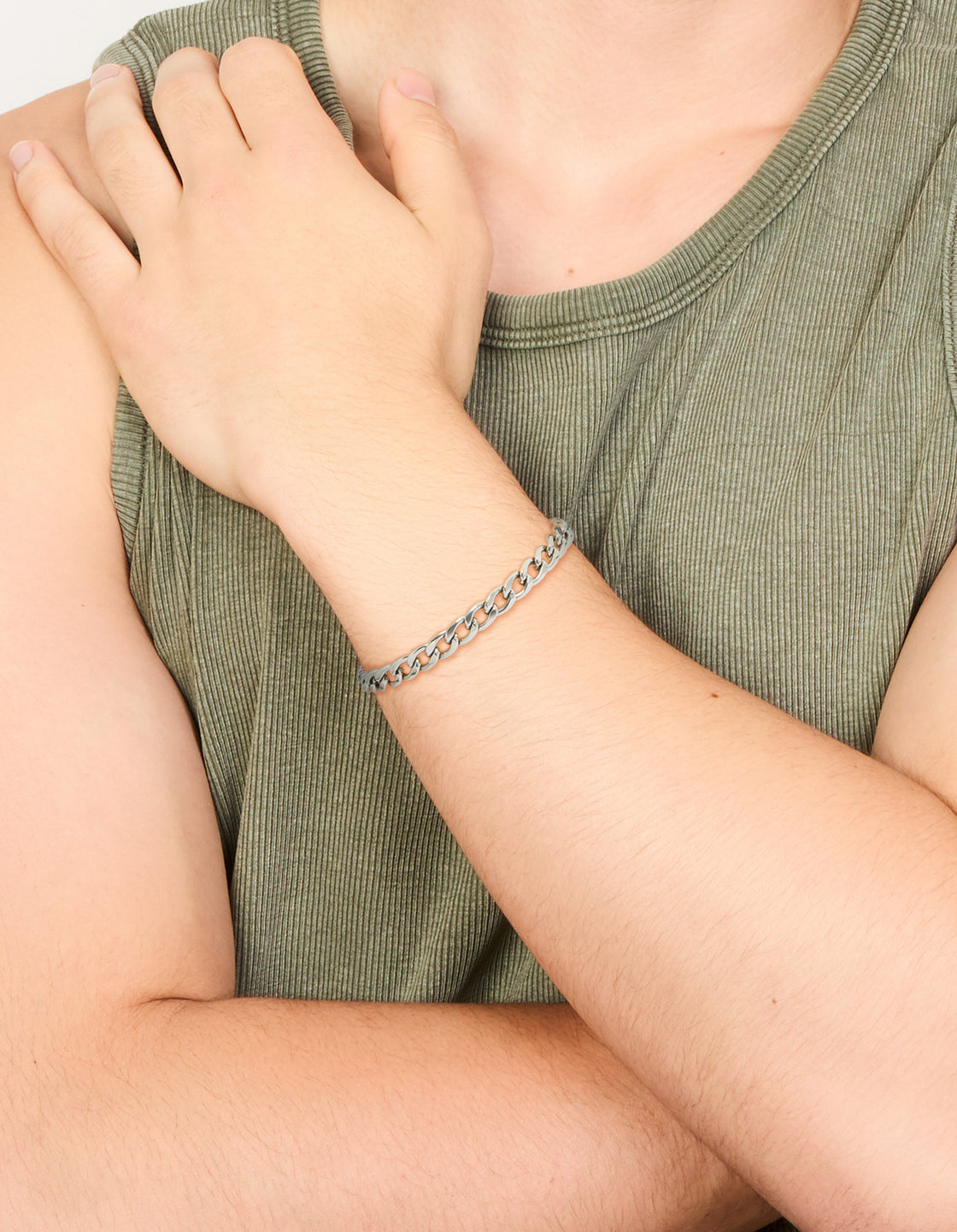 Featuring a mens waterproof stainless steel classic curb chain bracelet in silver on wrist view