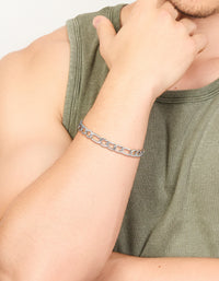 Featuring a mens waterproof stainless steel figaro chain bracelet in silver on wrist view - link has visual effect only