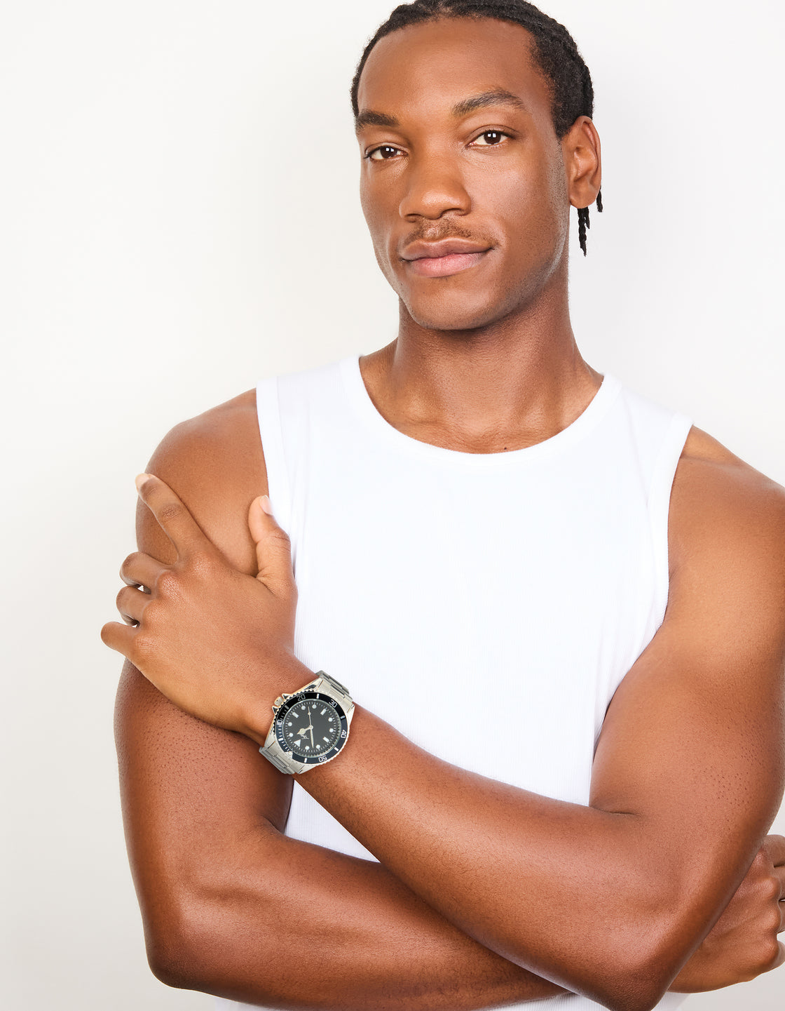 Showcasing a men's analog watch with black round dial and link-band strap in silver for sports occasions on model view
