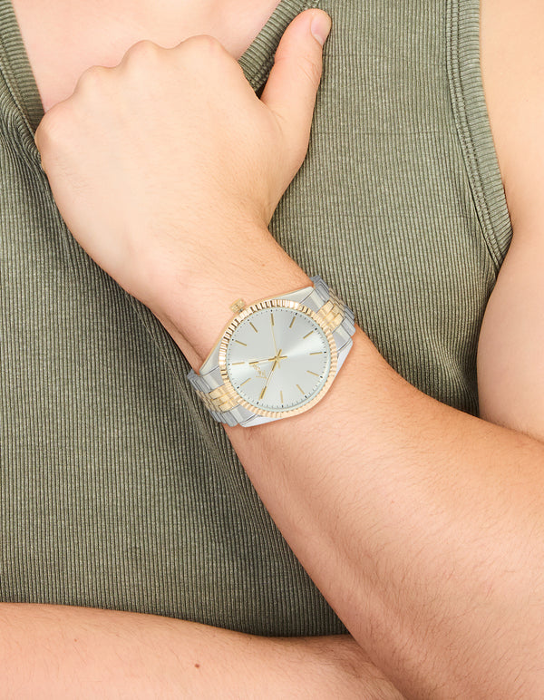 Showcasing a men's mixed metal etched link classic watch with white dial, round shape, formal occasion, link band in multi-color, and analog type on wrist view