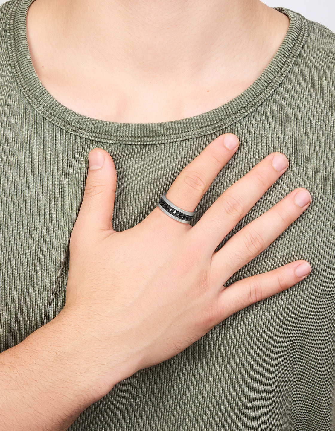 Crafted from waterproof stainless steel, this mens black chain detail band ring in silver on finger view