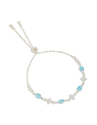 Introducing a silver plated cubic zirconia clover and blue oval bracelet turquoise accents and clear stones front - link has visual effect only