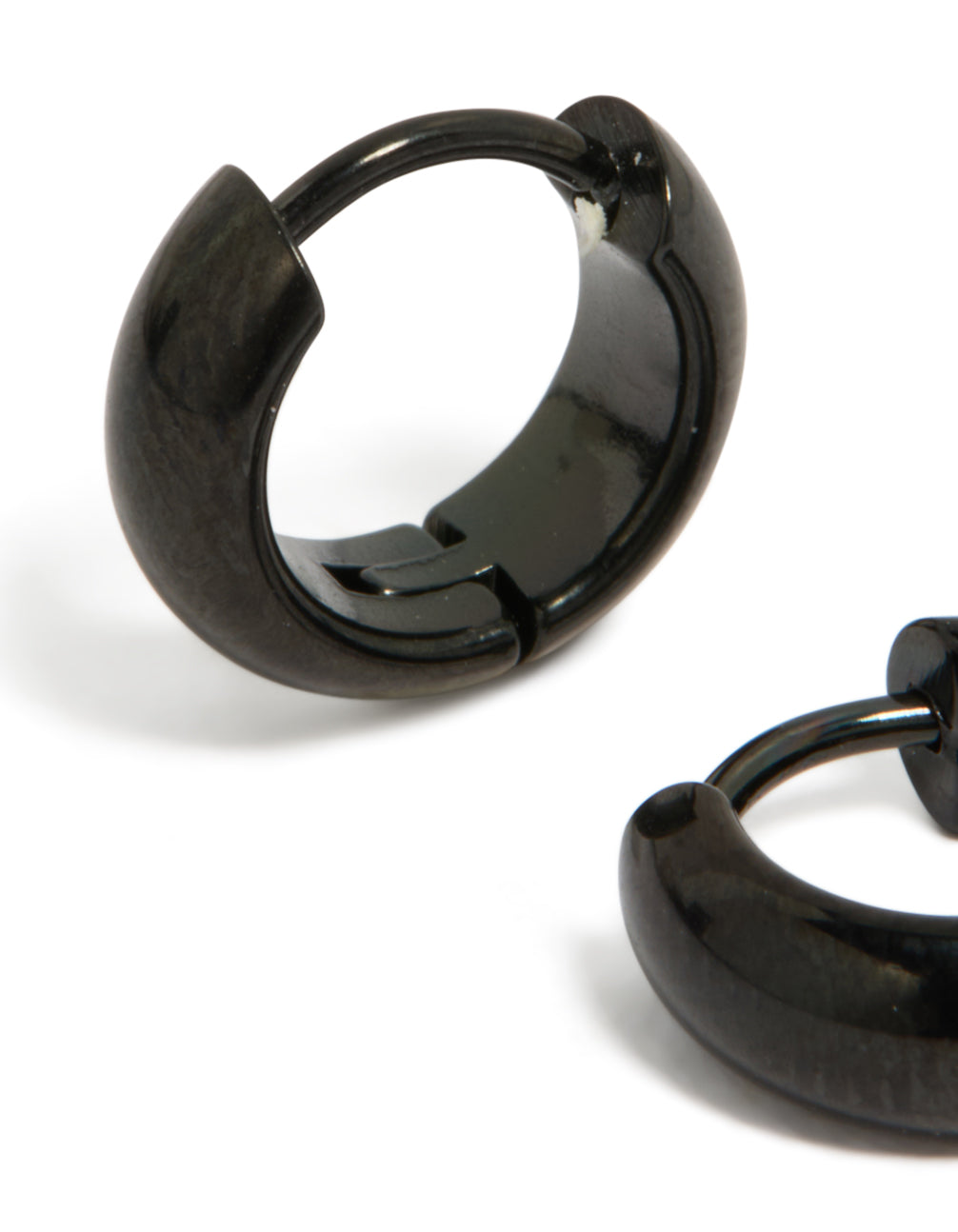 A detailed look at waterproof black coated stainless steel chunky huggie earrings close up view