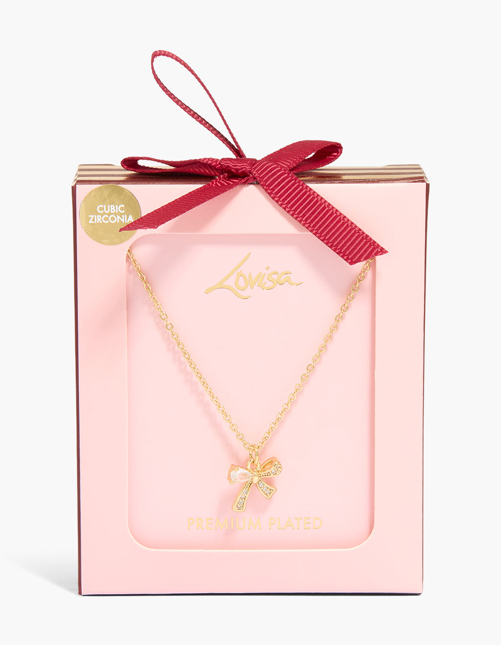 Showcasing a gold plated cubic zirconia small bow pendant necklace with chunky style shown in a packaging close up view
