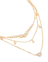 Showcasing a gold plated cubic zirconia tennis and pendant layered necklace with charm featuring dainty styling close up view - link has visual effect only