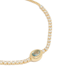Detailed view of gold plated cubic zirconia oval bezel toggle bracelet close up view - link has visual effect only