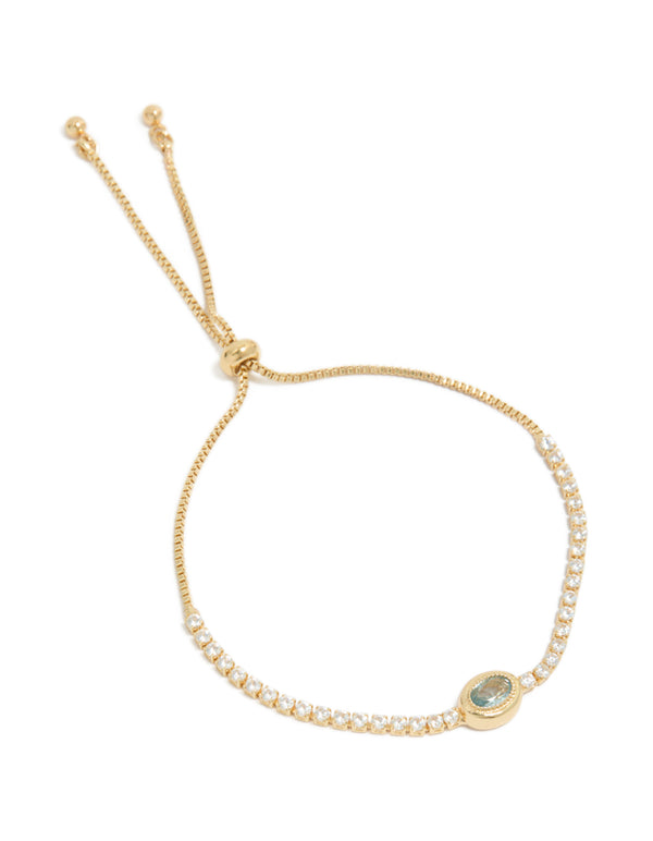 Showcasing a gold plated cubic zirconia oval bezel toggle bracelet front view