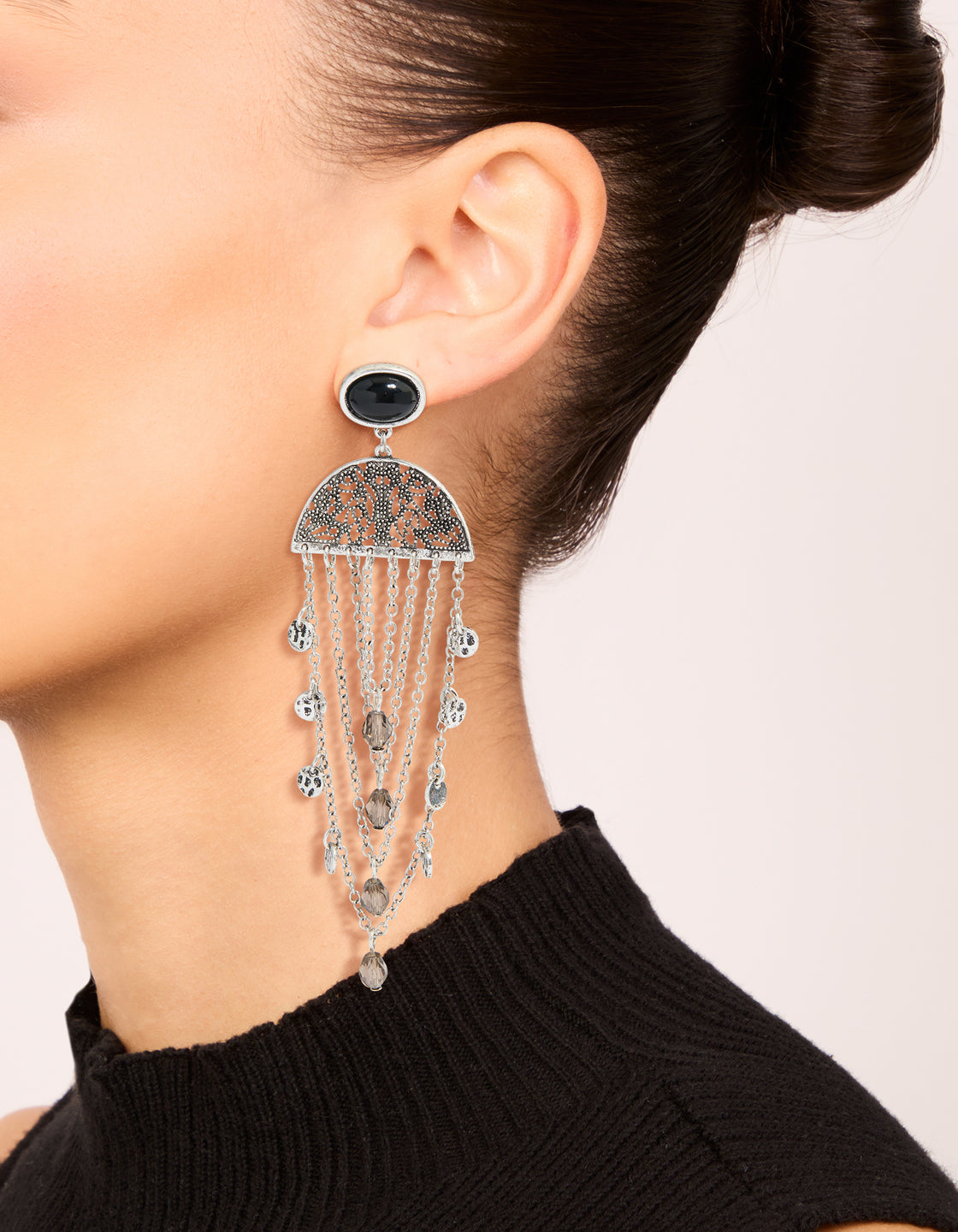 Explore statement boho chip drop earrings featuring beads, charms in silver on ear view