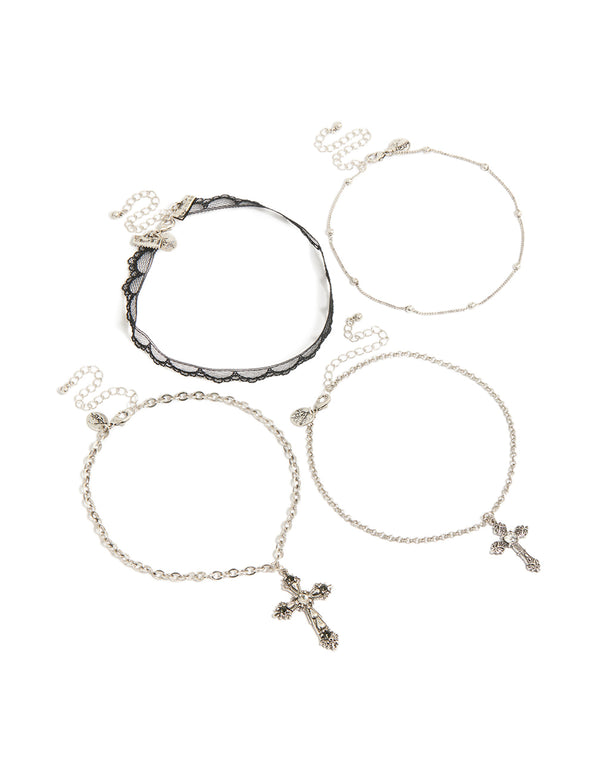 Featuring beaded cross and pearl necklaces in silver and black front view