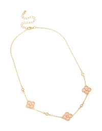 Detailed view of gold plated pink cubic zirconia flower trio necklace with floral and clasp in statement style front view - link has visual effect only