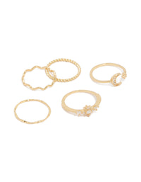 Showcasing gold plated celestial cubic zirconia with moon and star dainty rings in a five-pack front view - link has visual effect only