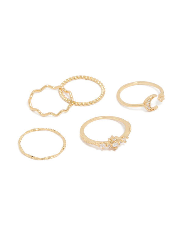 Showcasing gold plated celestial cubic zirconia with moon and star dainty rings in a five-pack front view