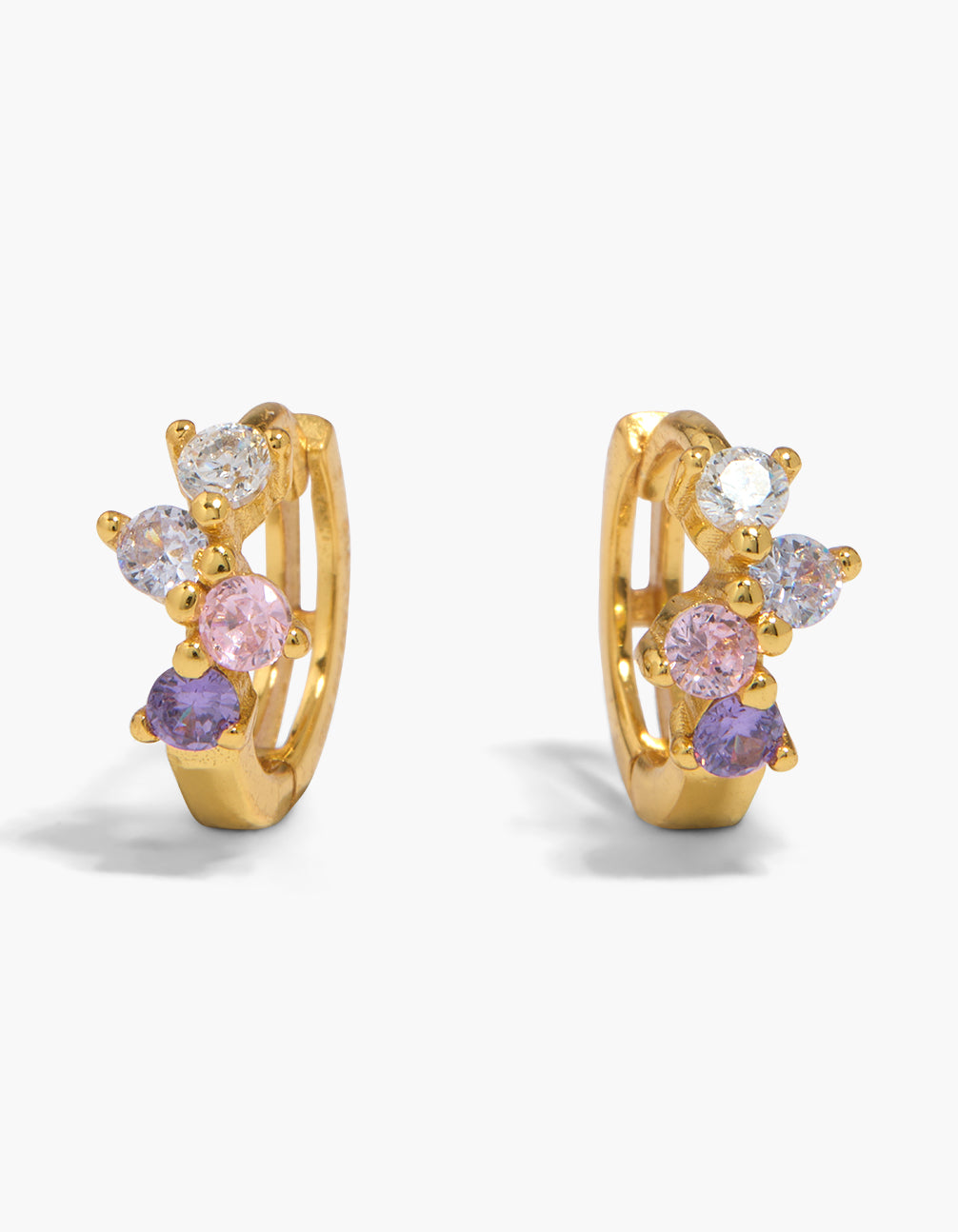 Stunning gold plated sterling silver multi cubic zirconia huggie earrings featuring light pink, plum, and clear stones in a huggie closure front view