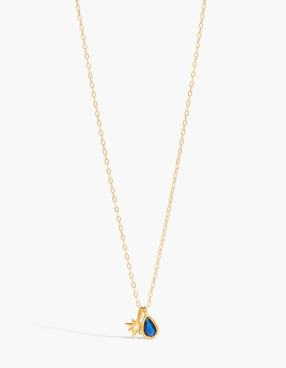 Featuring celestial star charm crafted from gold plated sterling silver with cubic zirconia necklace close up view