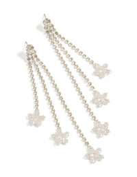 Beautifully crafted silver diamante triple tassel drop earrings featuring floral details in dainty style front view - link has visual effect only