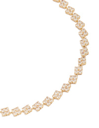 Showcasing a gold plated cubic zirconia multi flower tennis necklace with floral feature, crystal embellishments, and dainty styling in close up view - link has visual effect only