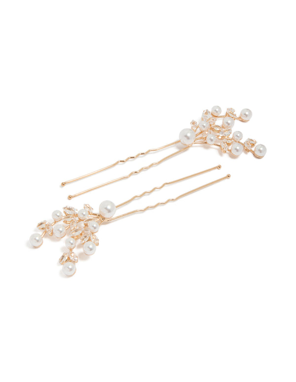 Showcasing gold diamante and pearl hair clips with floral accents front view