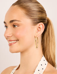 Crafted gold thin plain hoop earrings styled on model view - link has visual effect only