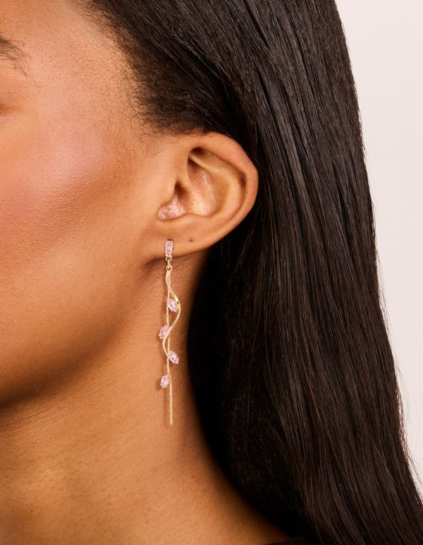 Featuring gold pink diamante swirl vine drop earrings on ear view