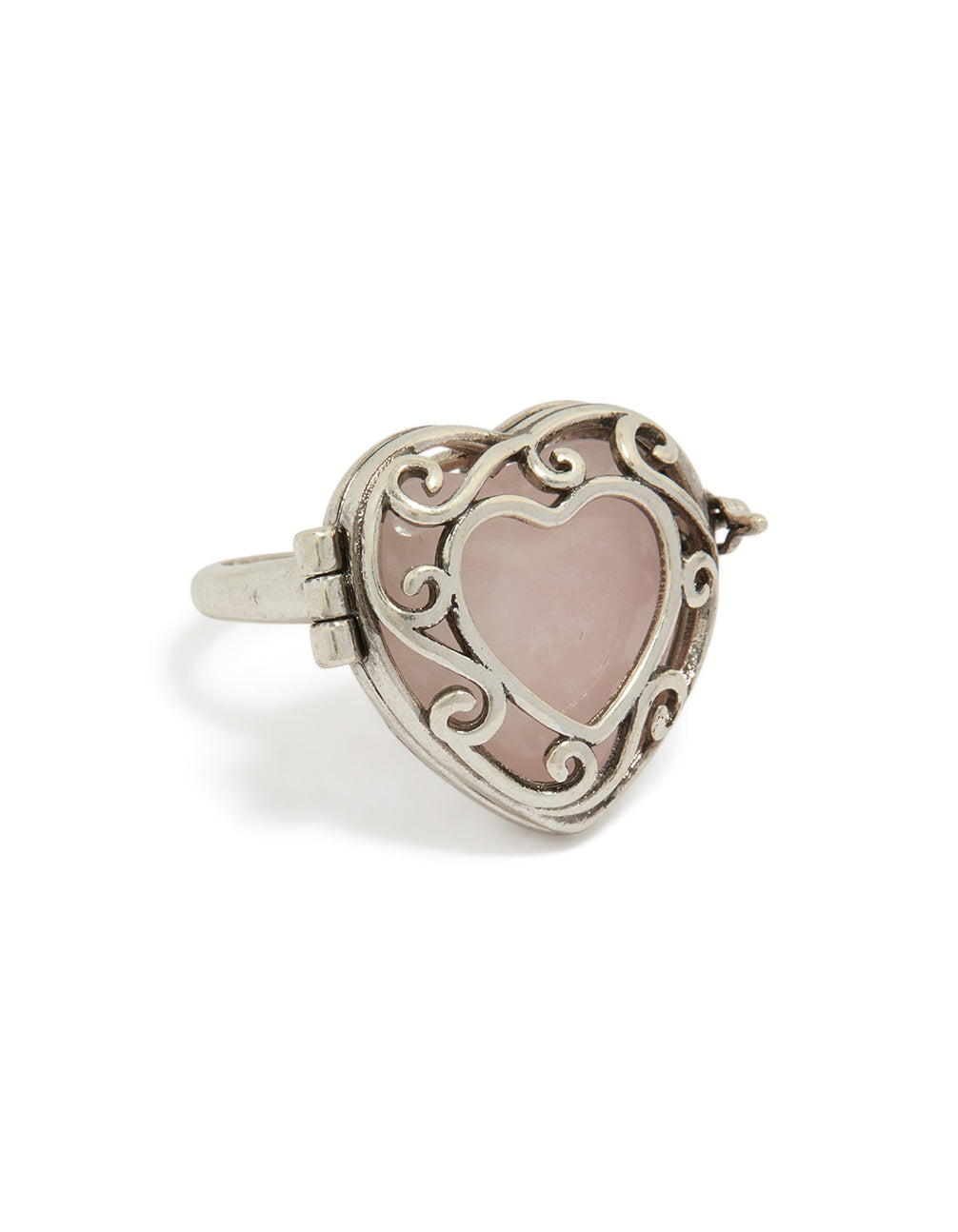 Showcasing an antique silver heart stone locket ring in rosy brown front view