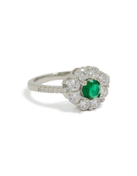 Showcasing a dainty floral ring with cubic zirconia in green, silver, and clear tones front view - link has visual effect only