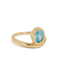 Discover this gold plated stainless steel statement ring featuring an oval blue cubic zirconia crystal front view - link has visual effect only