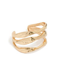 Statement wrist cuff in gold featuring irregular line design front view - link has visual effect only