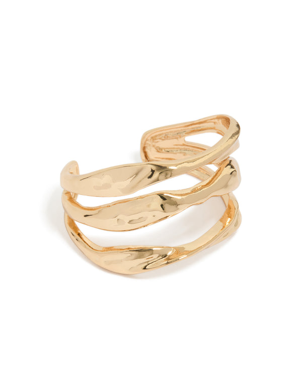 Statement wrist cuff in gold featuring irregular line design front view