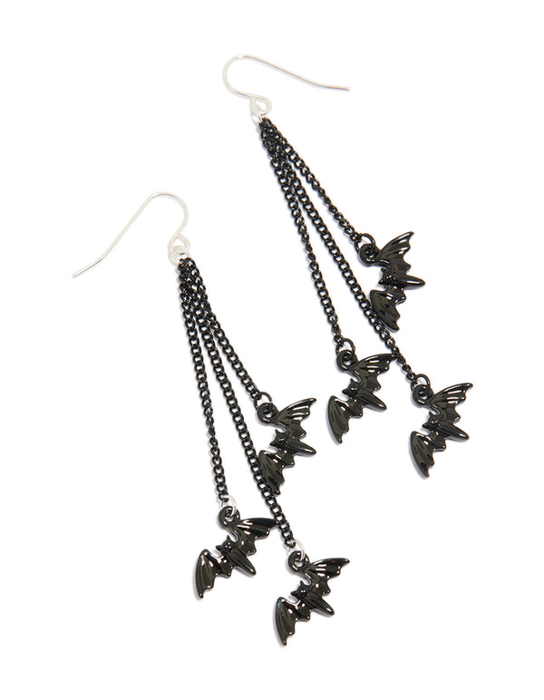 Showcasing multi chain bat drop earrings featuring charms in black and silver tones front view