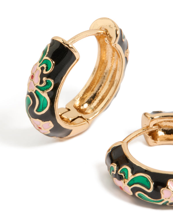 Designed with thick huggie earrings featuring floral pattern, enamel material, statement style in gold, black, and pink close up view