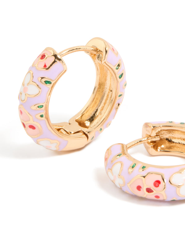 Featuring chunky floral enamel huggie earrings in lavender and light pink with gold accents highlighting intricate petal details close up view