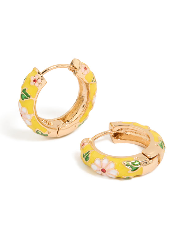 Explore these huggie earrings featuring floral yellow enamel with pink flower and leaf prints in statement gold front view